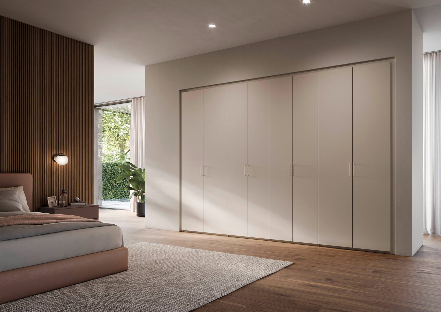 Schlafzimmer mit beigefarbenem Drehtürenschrank über Eck